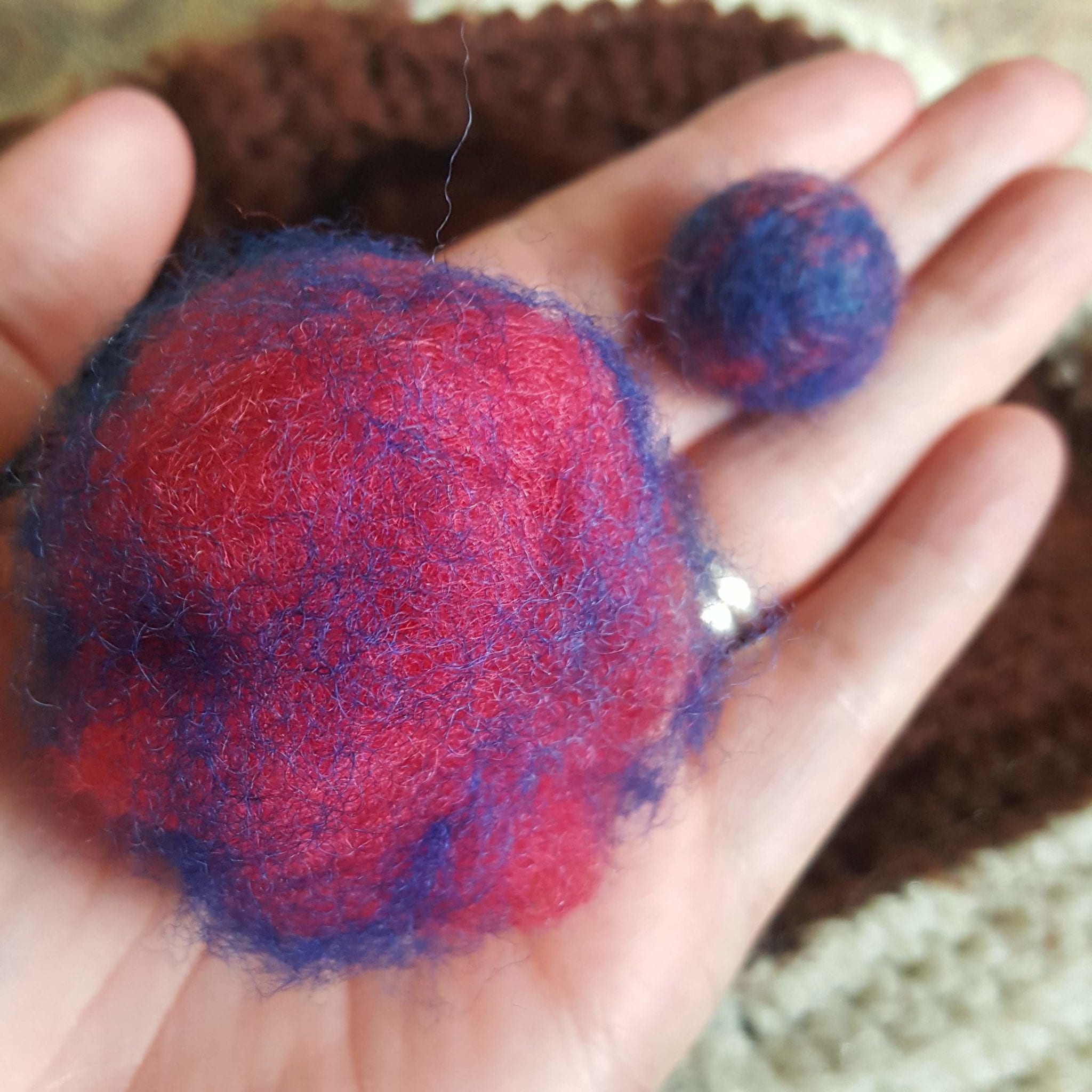 wet and needle felting wool beads gauging the amount of wool for each bead
