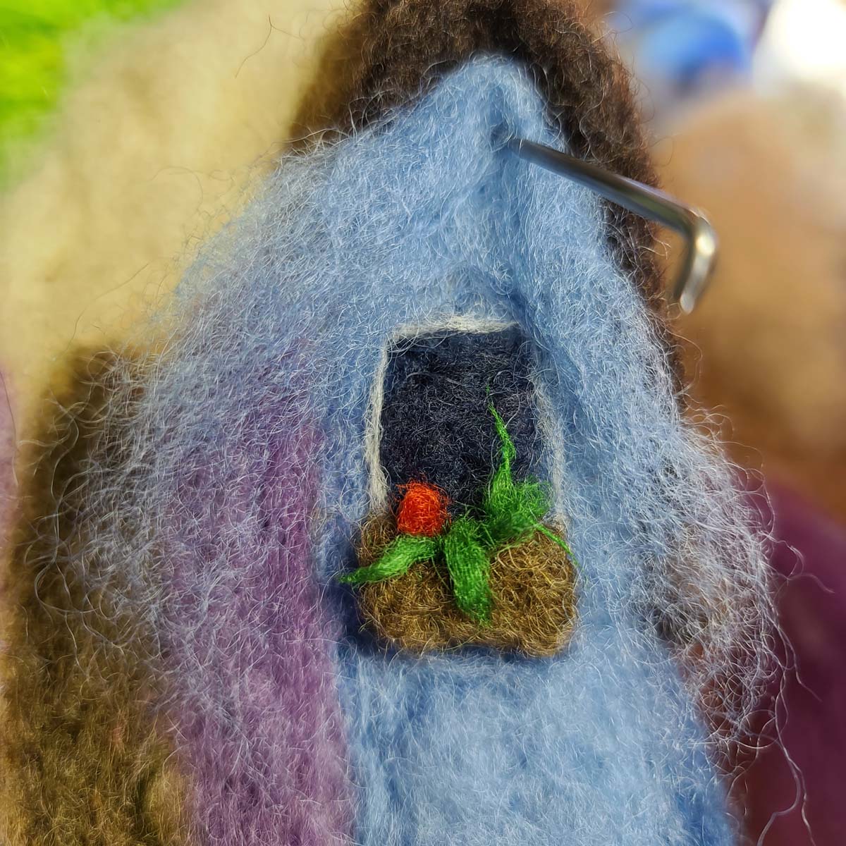 felting a roof gable and siding of a fairy house