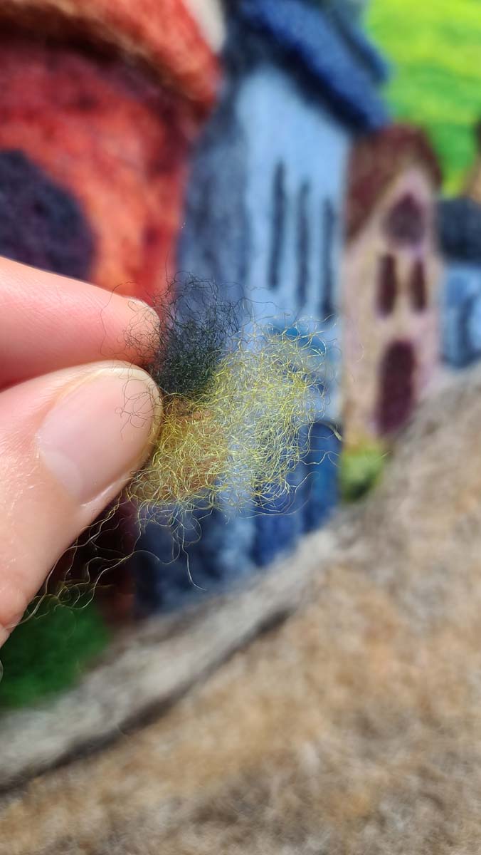 light and dark green wool to add a simple needle felted plant