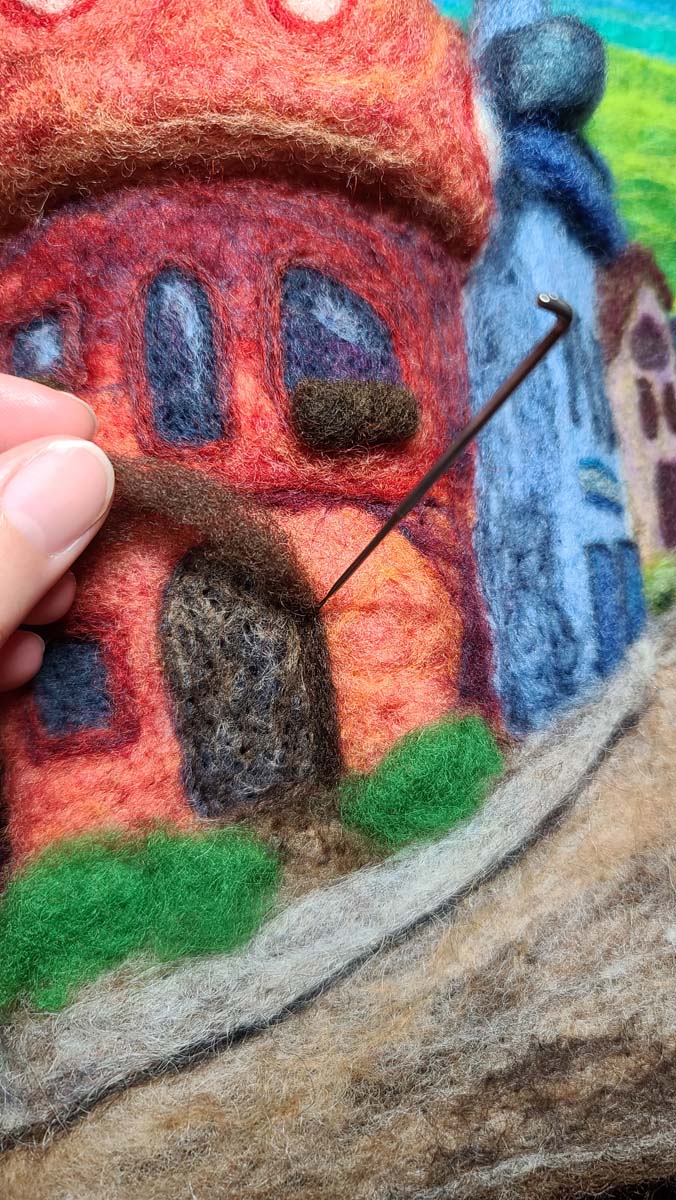 Needle felting doors and doorframes of a fairy house