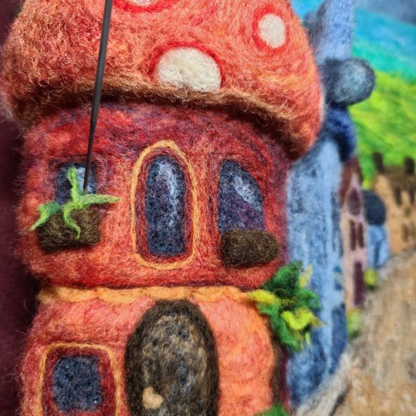 Learn how to needle felt a fairy village complete with fairy mushroom houses and window boxes!