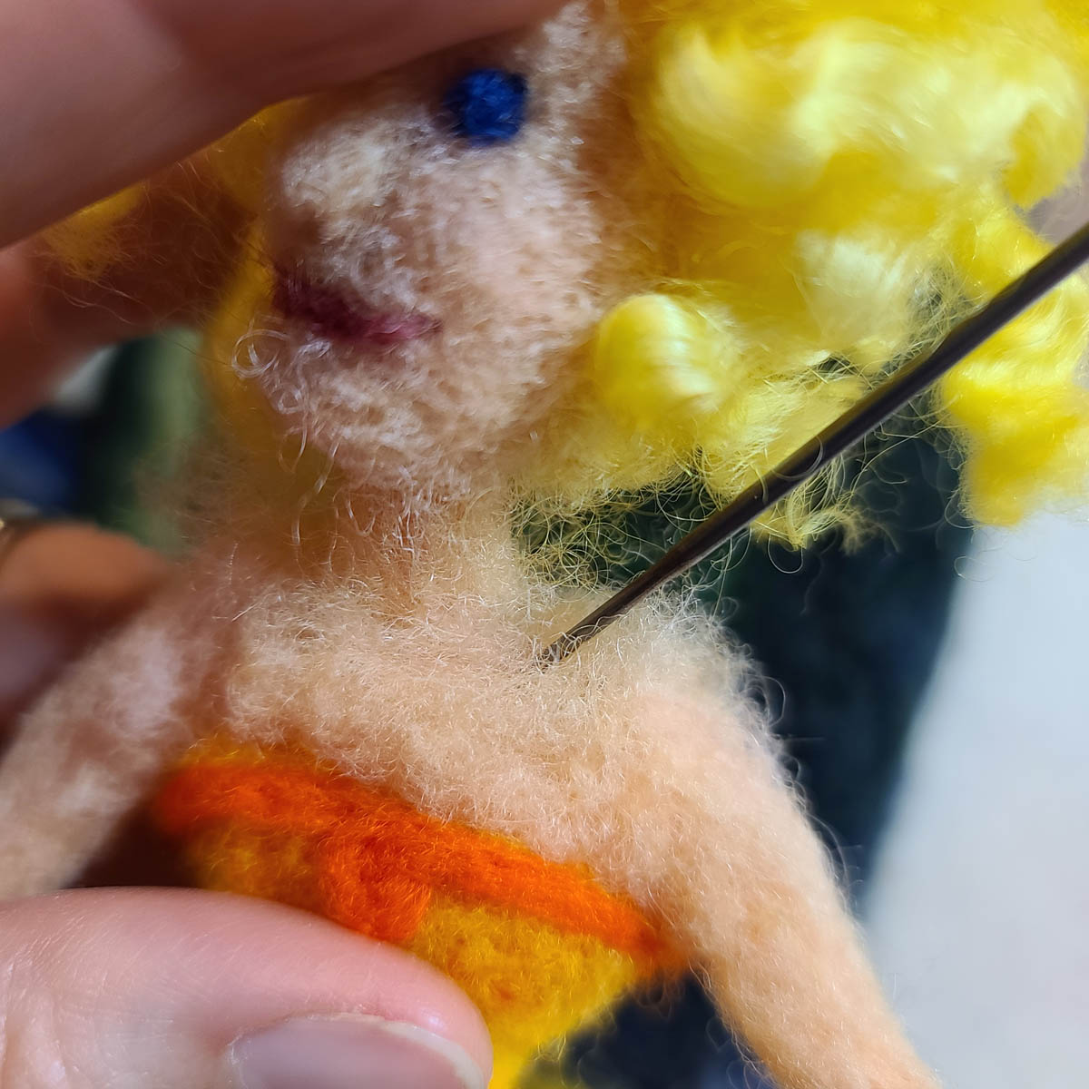 Needle Felting a Sun Fairy doll, attaching the head at the neck