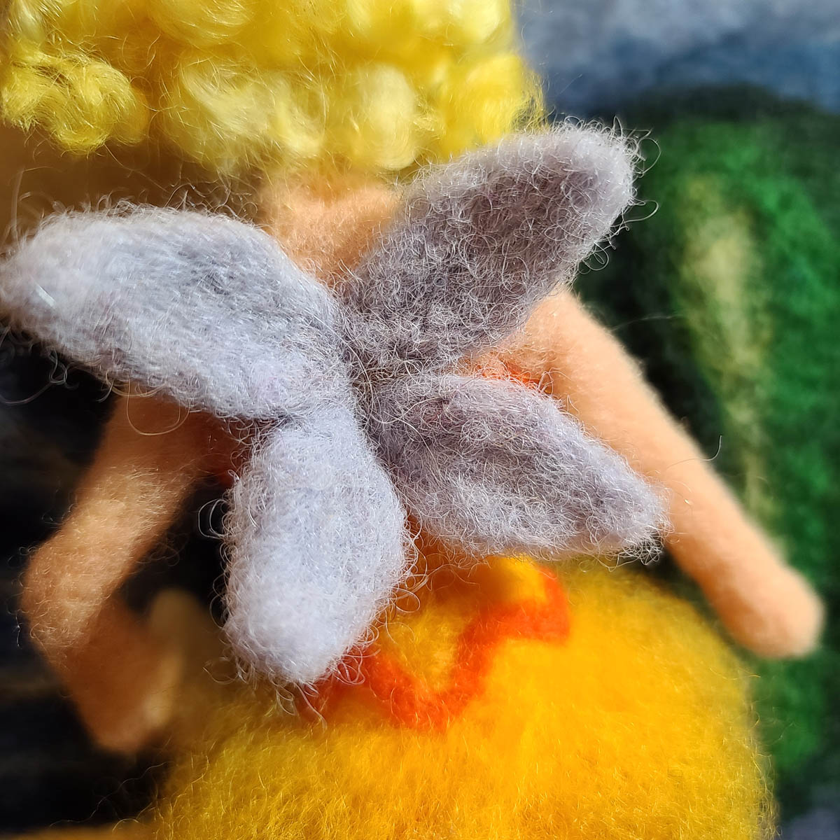 The Sun Fairy cover Illustration Needle Felting a Sun Fairy doll, attaching the wings