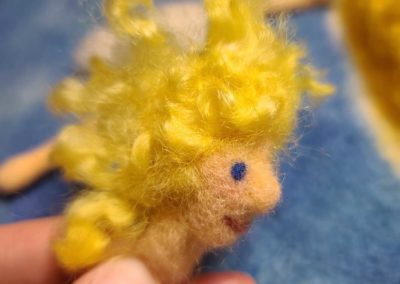 For The Sun Fairy I use curly locks, but you can use any color or style wool for the hair of your fairy.