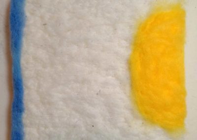 Begin adding blue wool.