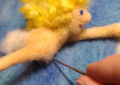 Continue felting the shoulders to create the desired size and shape.