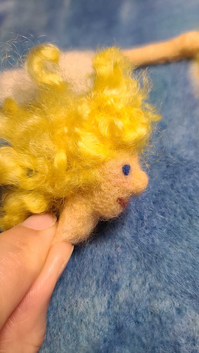 Sun Fairy Flies Into the Sun, needle felting lesson to learn techniques to create motion lines with wool.