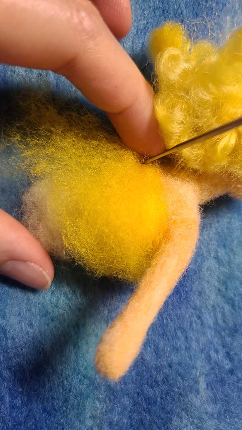 Sun Fairy Flies Into the Sun, needle felting lesson to learn techniques to create a figure with wings and motion lines - all with wool!