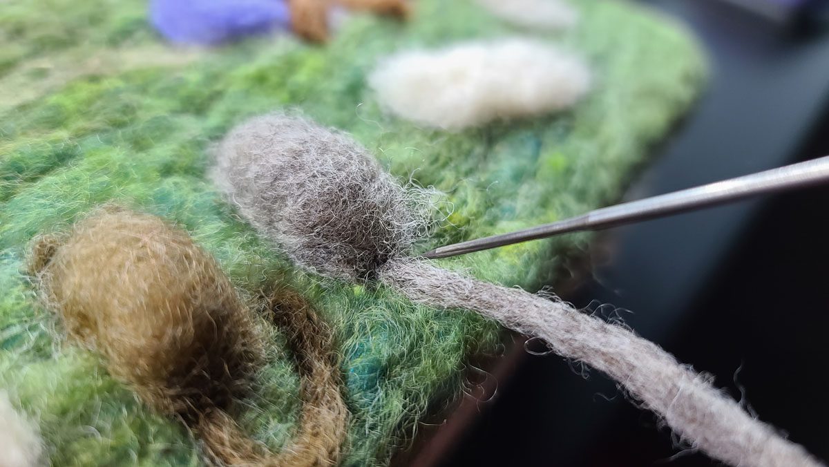Attaching a tail when needle felting, master tip from Hillary Dow